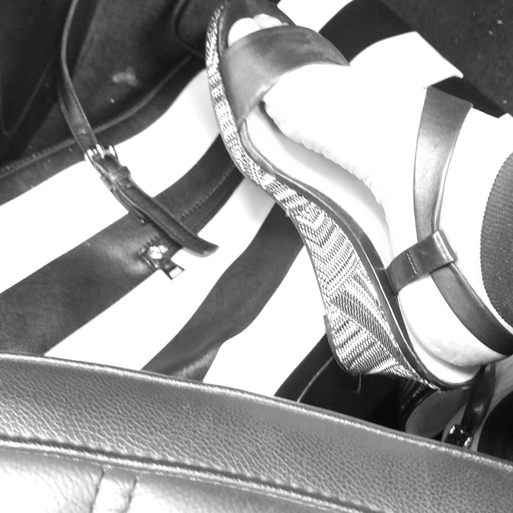 Black and white Cole Hahn wedge sandals.